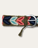 Morera belt by Ayni Ppacha, close-up at the buckle: olive-green sheep wool, hand-embroidered with arched leaves in navy, coral, light blue and natural white, silver-tone D-buckle with tassel