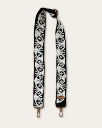 Lodoño bag strap by Ayni Ppacha at full length: black sheep wool, hand-embroidered with oval medallions, star flowers and fan motifs in natural white, brass-tone carabiners